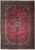 Full view of 10' x 14' Persian Kashan rug with red field and navy floral border