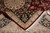 7'7" x 10' Tabriz rug folded back to reveal tight knotting and hand-woven cotton fringe