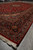 9'6" x 15' Kashan rug viewed lengthwise, fringe in front, medallion and borders receding