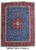 9'9" x 12'11" Persian Tabriz rug shown flat with blue field and red border