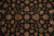 Detail of dense lustrous wool pile showing red, gold and sage floral motifs on black