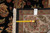 Back of the rug with tape measure and hand woven Oriental rug tag confirming size