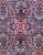 Close-up of navy field with ivory blossoms, red star rosette and slender boteh motifs