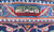 Woven signature cartouche in the upper border, Persian script over green, ivory and red bands