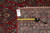 Reverse with measuring tape and original inventory tag documenting this antique wool Sarouk rug