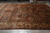 Rust and indigo Bakhtiar garden panel rug laid flat across a showroom floor, full view
