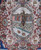 Central oval medallion close-up with horseman, domed mosque, cypress trees and grazing gazelle panels