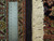 Ruler measuring knot density along the black selvage and ivory fringe of this Persian rug