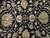 Close-up of ivory and sage palmettes on black field showing dense wool pile
