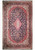 Navy blue Persian Kashan rug with rose medallion and ivory center, full overhead studio view
