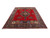 10x13 Persian Tabriz rug at an angle, crimson field, cartouche panels and indigo main border