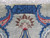 Woven signature cartouche in blue at one end of this hand-knotted Persian Kashan rug