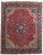 Full overhead view of 10x13 Persian Tabriz rug with deep red Mahi field and navy medallion