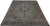 Light green Kashan rug photographed at an angle, showing 10x13 room size scale and chestnut border