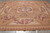 9'9" x 13'6" Aubusson rug on grey floor showing central floral medallion and acanthus border