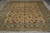 Full length view of the hand-knotted wool Kashan rug on grey tile flooring