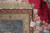 Corner with hand-woven Oriental rug tag reading rug number 58550 and size 8 x 10