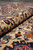 Rolled edge close-up showing plush wool pile, ivory ground and blue floral border of the rug