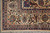 Corner of the rug with ivory main border, multiple guard stripes and clean selvage and fringe