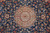 Ivory and rose central medallion with 8 petal rosette framed by dense blue vinework