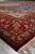 7'4" x 10'4" wool and silk Isfahan rug seen from floor level along red border
