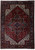 Full overhead view of hand-knotted wool Heriz rug, indigo border and stepped star medallion