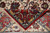 Folded corner revealing dense knotting on the back of this fine 500 knots per square inch rug