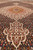 Low angle view along the field showing pendant medallion, dense fish pattern and wool pile