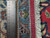 Ruler laid across the border showing knot scale, dense wool pile and ivory cotton fringe