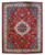 Full view of red 10x13 Persian Tabriz rug with navy medallion and ivory floral borders