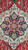 Close-up of the navy and ivory center medallion with gold palmettes on deep red field