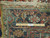 Back of the rug with ruler confirming hand-woven knot count and durable cotton foundation