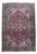 Full overhead view of rose red Persian Heriz rug with navy border and ivory corner spandrels
