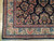 Corner detail showing rose main border, ivory floral guard stripes and navy field with bouquets