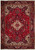 Full view of 8x11 Persian Heriz rug, red field, ivory star medallion, navy border