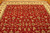 9x12 Oriental wool rug angled view showing all over floral pattern in red and ivory