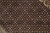Detail of allover Mahi fish pattern in rust, ivory and olive green on black