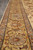 Detail of the gold border with silver-grey rosettes and coral vine scrolls running lengthwise