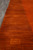 Row of small rectangular Gabbeh motifs marching along the terracotta border of this modern rug