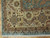 Corner detail of ivory main border, guard stripes and ivory fringe on wool Oriental rug