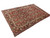 Angled full length display of oversize red and navy Persian Mahal wool rug on white