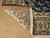 Back of hand-knotted Nain rug showing even knot rows, cotton foundation and ivory fringe
