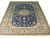 Royal blue Persian Nain rug with ivory floral border and central star medallion, full view
