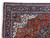 Corner close-up of ivory spandrel, navy main border and cream fringe on Persian wool rug