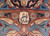 Woven signature cartouche in Persian script sits within the copper border of this signed Kashmar rug
