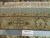Ruler against the weave documenting knots per square inch on this authentic hand-knotted Indian rug