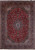Red Persian Kashan rug with navy lobed medallion, ivory spandrels and dense all-over floral field