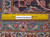 Back of the hand-knotted wool rug beside a ruler showing knots per square inch