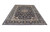 10x15 Persian Kashan area rug angled on white, showing navy field and light blue border
