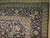 Corner detail with lavender ivory guard stripes, palmettes and rust apricot flowers on navy border